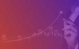 orange and purple gradient growth chart with hand pointing at growth line